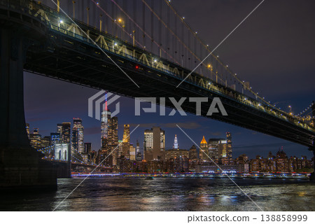 Manhattan skyline at night seen from Brooklyn with Manhattan bridge on the foreground Manhattan skyline at night seen from Brooklyn with Manhattan bridge on the foreground 138858999