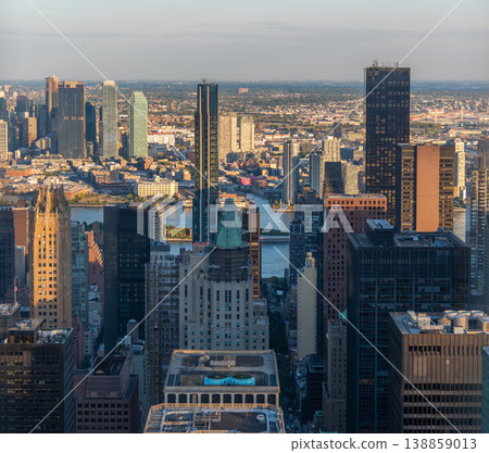 Skyscrapers in Manhattan under seen from above at sunset Skyscrapers in Manhattan under seen from above at sunset 138859013