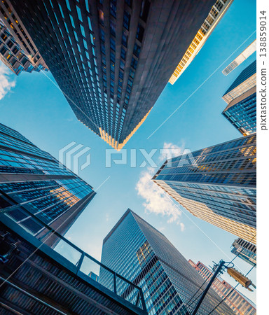 Skyscrapers in Midtown Manhattan under a blue sky 138859014