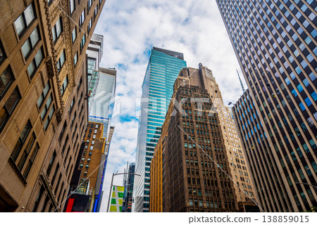 Skyscrapers in Midtown Manhattan under a cloudy sky 138859015