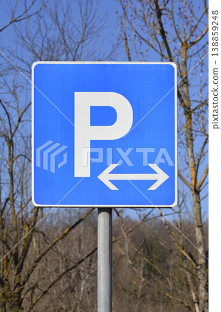 Blue parking traffic sign with arrow 138859248