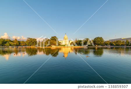 World famous United States Capitol Building reflected on the pool at sunset 138859307