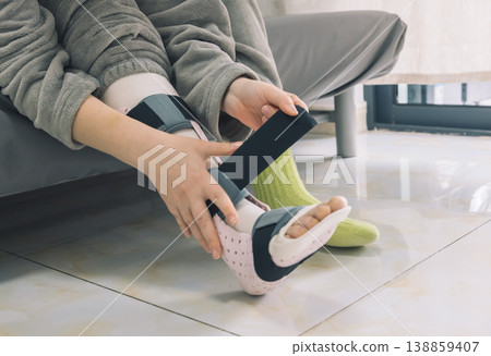 Applying a medical leg splint for injury recovery Applying a medical leg splint for injury recovery 138859407