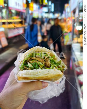 Hand-Held Deliciousness: Savory Wrap from a Bustling Asian Night Food Market in China 138859480