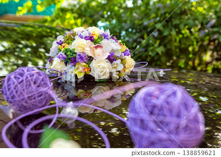 Wedding bouquet on the hood of a white retro car Wedding bouquet on the hood of a white retro car 138859621