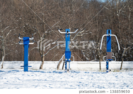 Empty urban fitness area with exercise machines, cold weather . Outdoor sport concept . Empty urban fitness area with exercise machines, cold weather . Outdoor sport concept . 138859650
