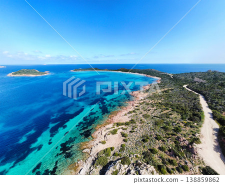 Aerial view of Capo Coda Cavallo promontory under clear blue sky 138859862