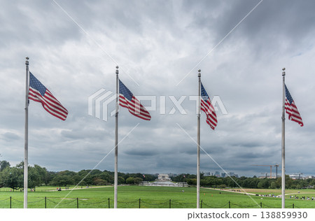 American Flags in Front of Lincoln Memorial under Dramatic Gray Sky 138859930