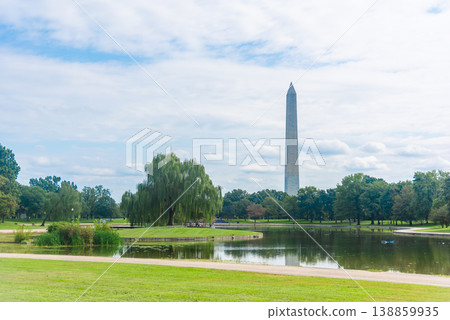 Washington Monument Seen from the National Mall under Broken Clouds Washington Monument Seen from the National Mall under Broken Clouds 138859935