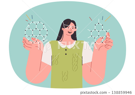 Woman student holds molecular models of chemical elements while studying science at university Woman student holds molecular models of chemical elements while studying science at university 138859946