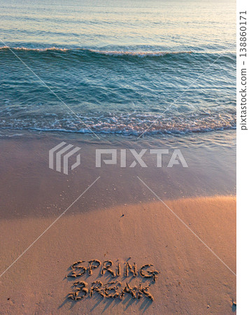 Spring Break written on the foreshore at sunset 138860171