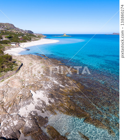 Aerial view of La Pelosa beach with historical Aragonese tower in Stintino Aerial view of La Pelosa beach with historical Aragonese tower in Stintino 138860274
