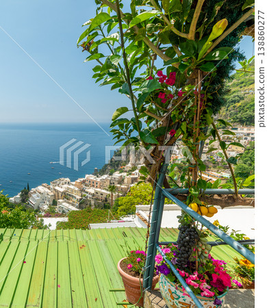 Shore of Positano with colorful plants in the foreground Shore of Positano with colorful plants in the foreground 138860277