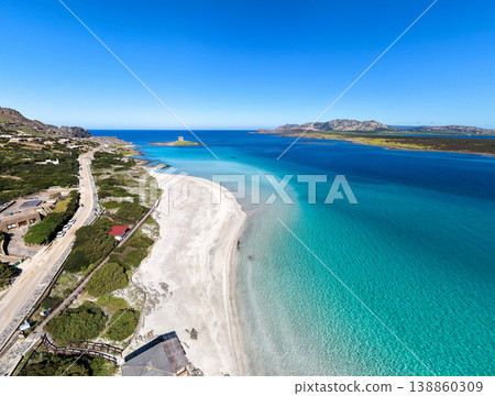 Aerial view of La Pelosa beach in Stintino on a sunny spring day Aerial view of La Pelosa beach in Stintino on a sunny spring day 138860309