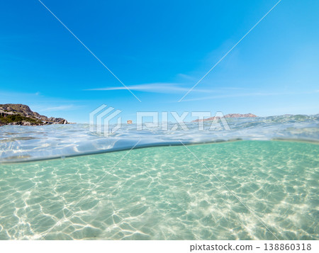 Split underwater view of La Pelosa beach in springtime Split underwater view of La Pelosa beach in springtime 138860318