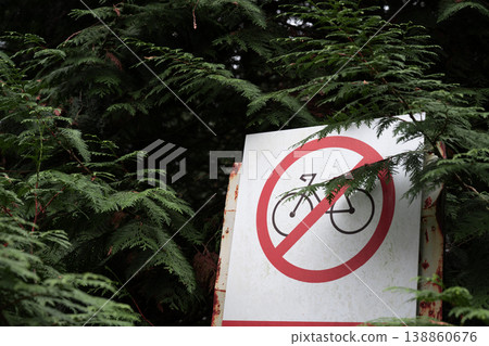 Bicycle no entry sign against forest background 138860676