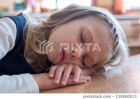 School girl sleeping at the school is sleep at the desk. Student. Pupil studying School girl sleeping at the school is sleep at the desk. Student. Pupil studying 138860813