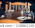 Setting the festive table.  Empty  glasses and plates on wooden table 138861136