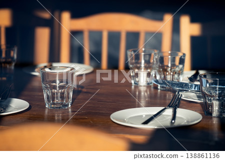 Setting the festive table.  Empty  glasses and plates on wooden table 138861136