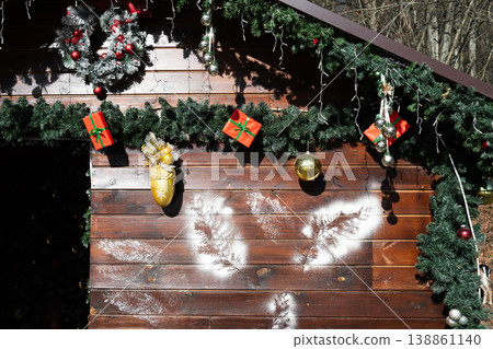 Wooden house decorated for Christmas . Festive and warm home vibe Wooden house decorated for Christmas . Festive and warm home vibe 138861140