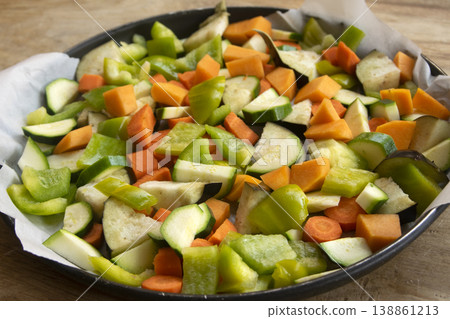 Raw chopped vegetables on baking tray Raw chopped vegetables on baking tray 138861213