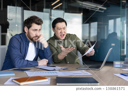 Angry boss expressing frustration and arguing with a sad, stressed employee during a tense work meeting, highlighting workplace conflict, pressure, and poor management Angry boss expressing frustration and arguing with a sad, stressed employee during a tense work meeting, highlighting workplace conflict, pressure, and poor management 138861571