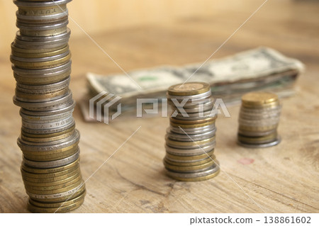 Stacks of international coins with dollar bill Stacks of international coins with dollar bill 138861602