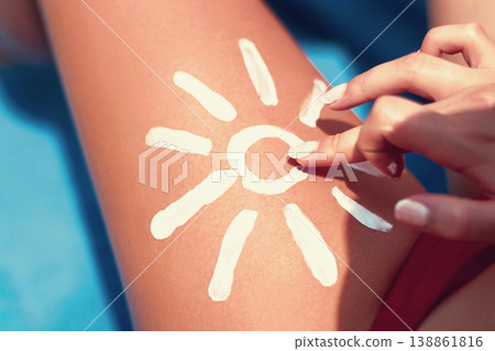 Closeup  female  leg with sun shape. Sun protection sun cream, on her smooth tanned legs. Sunblock. Skincare. 138861816