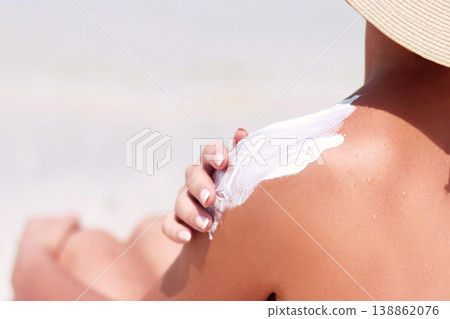 Woman apply sun cream protection on tanned shoulder. Beauty skincare aging body care. Bottles of sunscreen. Woman apply sun cream protection on tanned shoulder. Beauty skincare aging body care. Bottles of sunscreen. 138862076