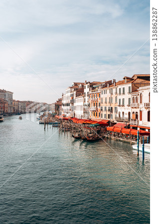 Canal view with buildings and boats during the day in a city with waterways 138862287