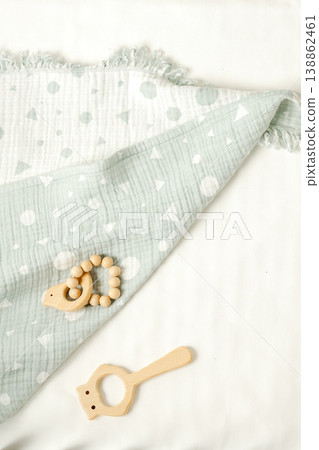 Toys and a blanket on a soft surface for baby playtime on a sunny day Toys and a blanket on a soft surface for baby playtime on a sunny day 138862461