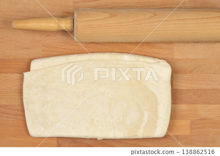 Raw Puff Pastry Dough and Rolling Pin Raw Puff Pastry Dough and Rolling Pin 138862516