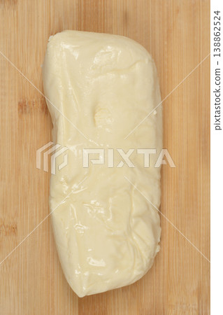 Fresh Mozzarella Cheese on Wooden Board Fresh Mozzarella Cheese on Wooden Board 138862524