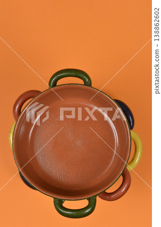 Empty Clay Pots on Orange Background Empty Clay Pots on Orange Background 138862602