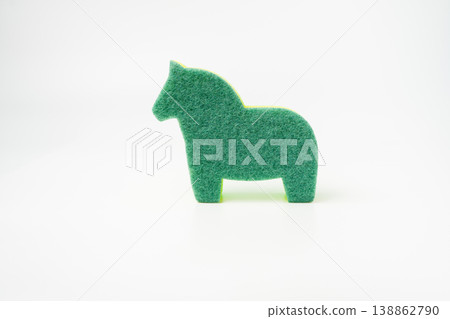large multi-colored sponge for washing dishes in the form of a horse isolated large multi-colored sponge for washing dishes in the form of a horse isolated 138862790