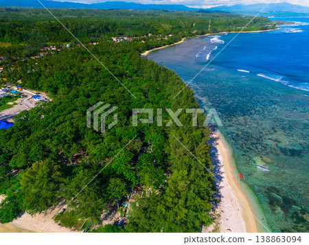 The beautiful aerial view of the morning on the beach with blue sea water in Kaur, Bengkulu, Indonesia The beautiful aerial view of the morning on the beach with blue sea water in Kaur, Bengkulu, Indonesia 138863094