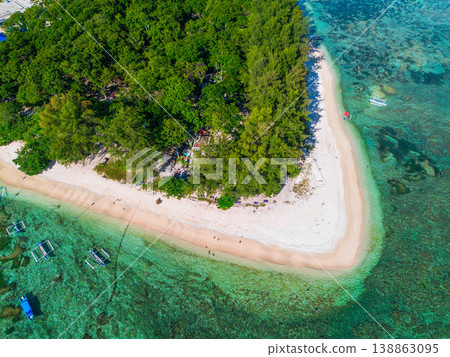 The beautiful aerial view of the morning on the beach with blue sea water in Kaur, Bengkulu, Indonesia The beautiful aerial view of the morning on the beach with blue sea water in Kaur, Bengkulu, Indonesia 138863095
