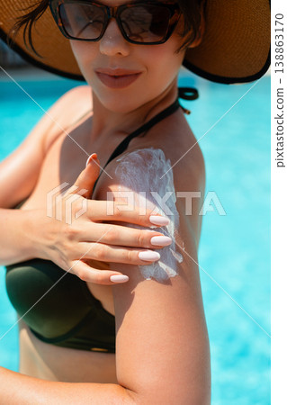 Macro Close Up Of Woman Applying Sunscreen On Shoulder With Smooth Skin Texture In Bright Sunlight. Skincare And Beauty Concept 138863170