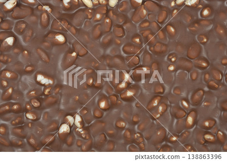 Milk chocolate bar with puffed rice texture background 138863396