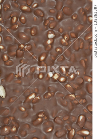 Milk chocolate bar with puffed rice texture background Milk chocolate bar with puffed rice texture background 138863397