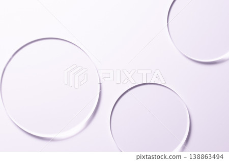 Glass circles on a pink background. A template for placing samples of cosmetics or medical products or food. 138863494