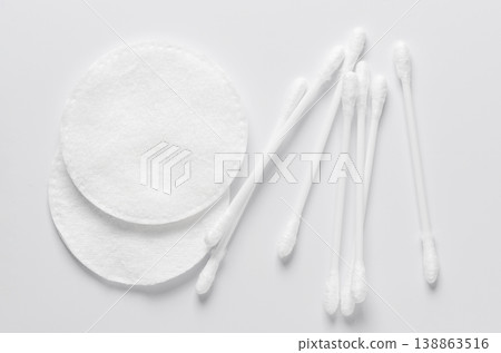 Cotton swabs and cotton pads for hygiene. White background. Cotton swabs and cotton pads for hygiene. White background. 138863516