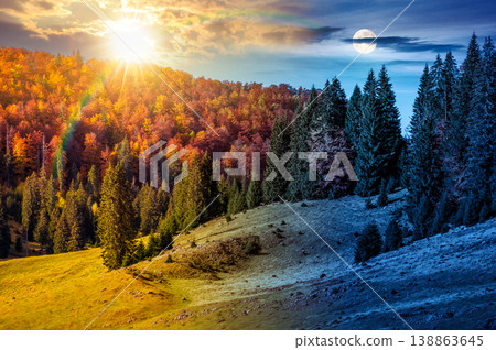 day meet night. hillside with coniferous forest on a meadow in mountain landscape on autumn equinox. sun and moon over wonderful view surrounded by spruce trees on the slope. transylvania wonderland day meet night. hillside with coniferous forest on a meadow in mountain landscape on autumn equinox. sun and moon over wonderful view surrounded by spruce trees on the slope. transylvania wonderland 138863645