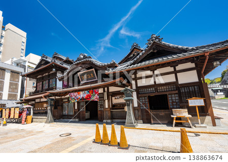 Exterior view of Dogo Onsen Main Building in Matsuyama City, Ehime Prefecture, a sunny tourist scene. Exterior view of Dogo Onsen Main Building in Matsuyama City, Ehime Prefecture, a sunny tourist scene. 138863674
