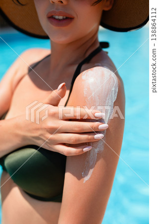 Woman Applying Sunscreen On Shoulder With Hand Motion Close Portrait In Summer Sunlight. Skincare Routine And Sun Protection Concept 138864112