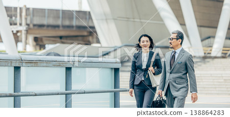 Senior businessmen (male and female) 138864283