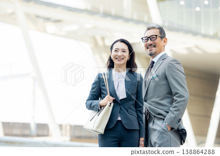 Senior businessmen (male and female) 138864288