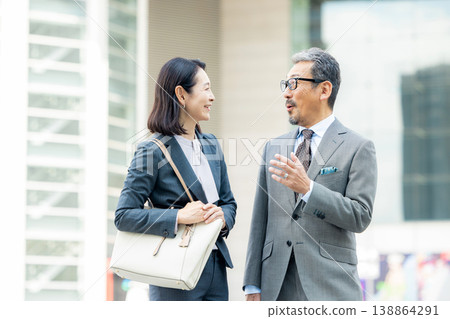 Senior businessmen (male and female) 138864291