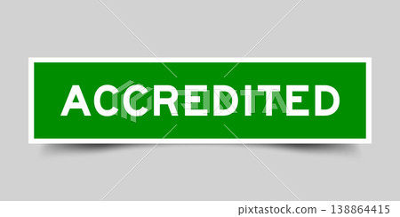Green color square shape sticker label with word accredited on gray background 138864415