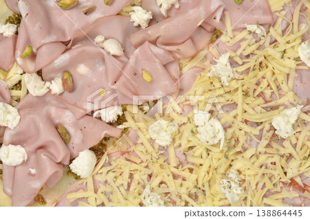 Pizza with mortadella pistachios and mixed cheese topping Pizza with mortadella pistachios and mixed cheese topping 138864445